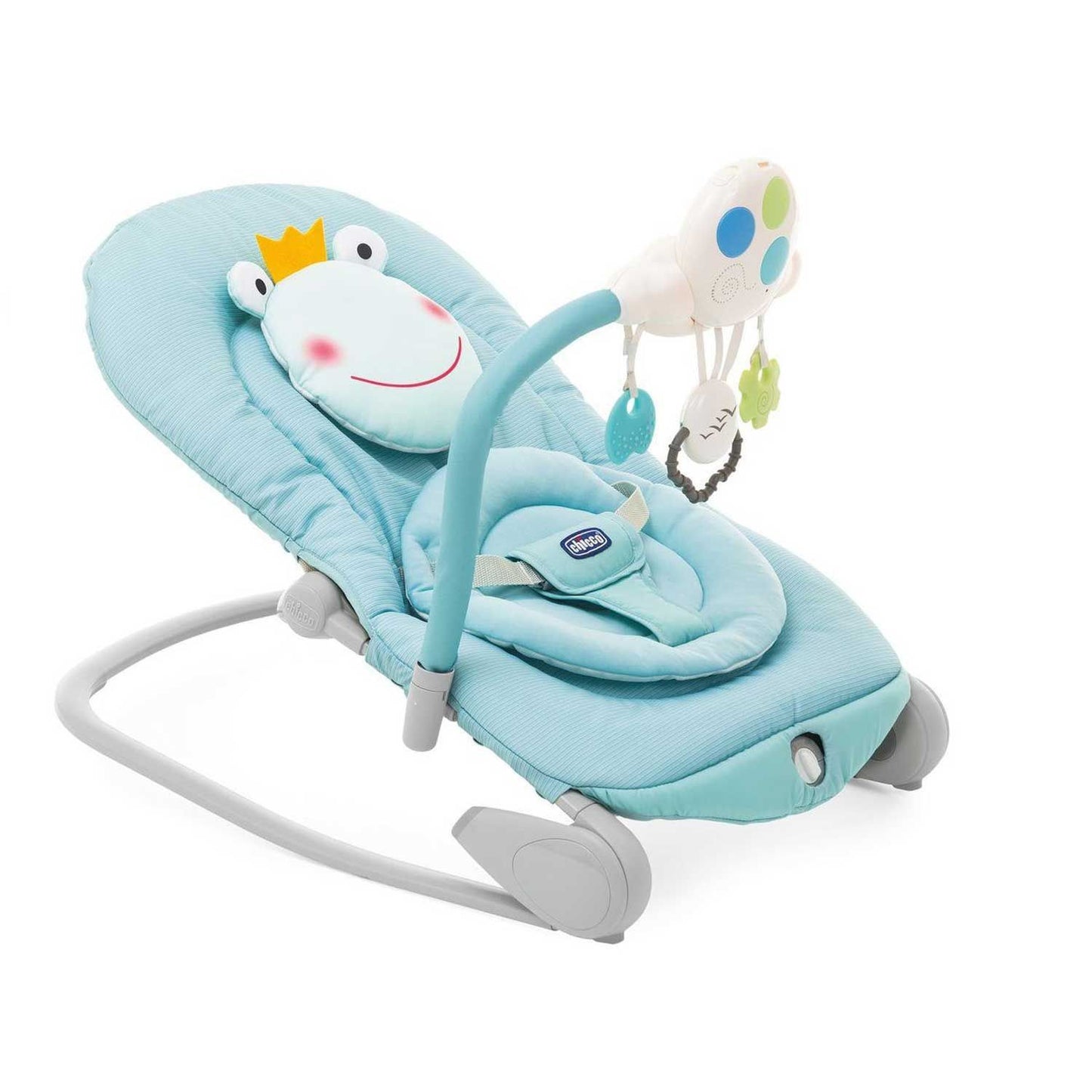 A blue baby bouncer with a smiling frog headrest and a hanging mobile with toys entertains a baby.