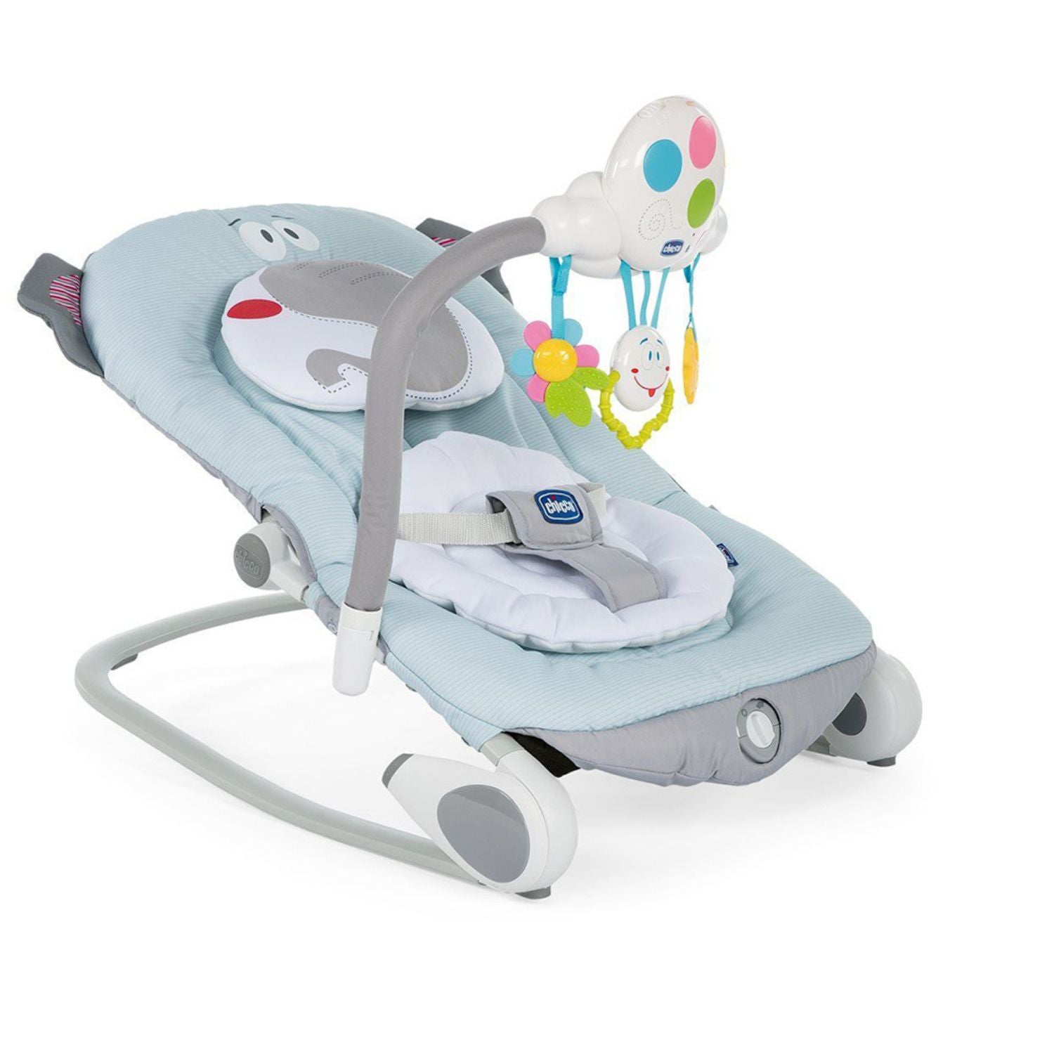 A blue and gray baby bouncer with an elephant design rocks gently. The bouncer features a hanging mobile with colorful toys to stimulate baby's senses.