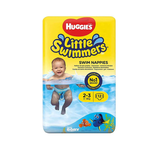 A smiling baby wearing Huggies Little Swimmers splashes in the water. The packaging features Dory from Finding Nemo and highlights the swim diaper's size (2-3, 3-8kg) and maximum protection.