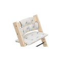 Wooden high chair features a removable cushion with a light blue and white bird pattern for comfortable and stylish seating. 
