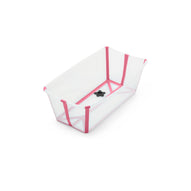 Empty white and pink plastic baby bathtub with drain plug. 
