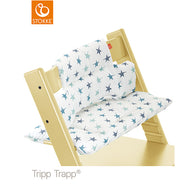 Stokke Tripp Trapp high chair fitted with a white and blue star-patterned baby cushion set. 
