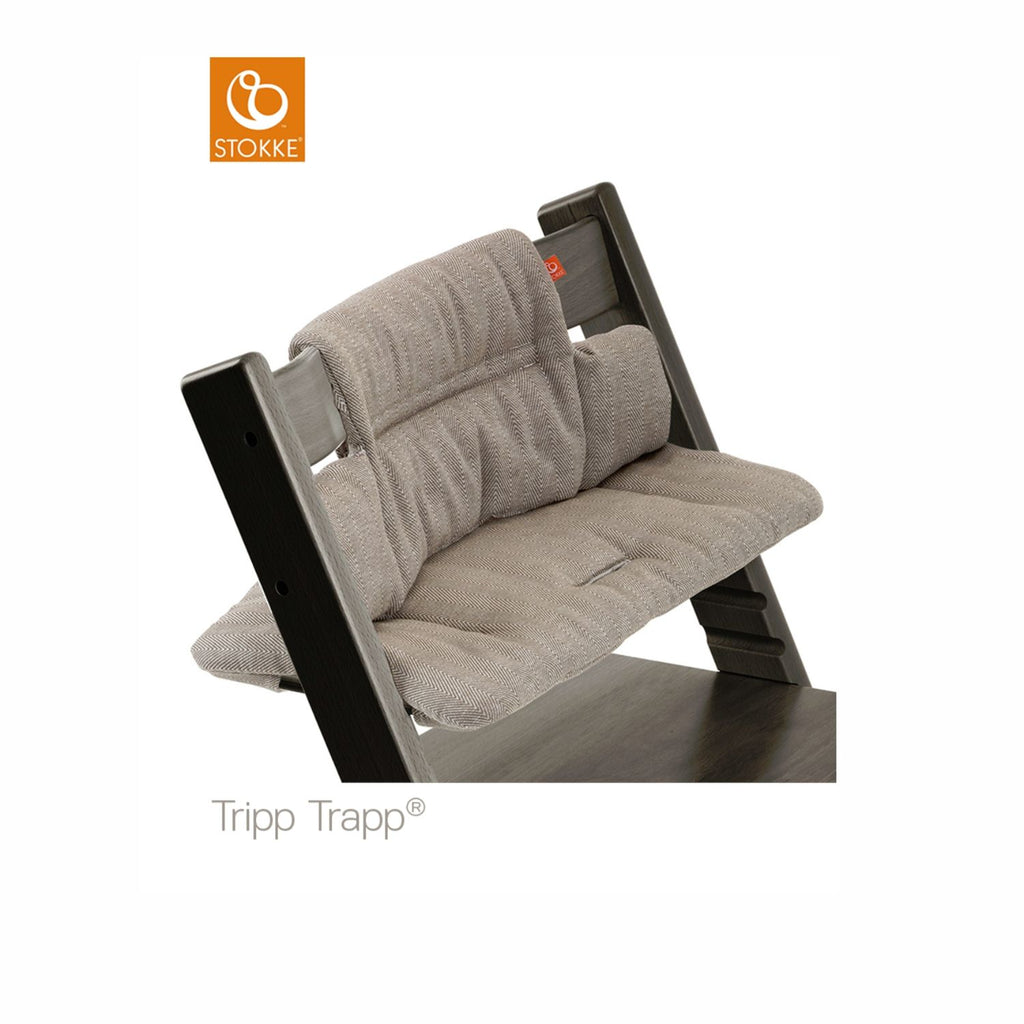Stokke Tripp Trapp high chair featuring a grey herringbone seat cushion for added comfort and style. 

