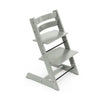 Modern gray wooden high chair with adjustable seat and footrest, suitable for babies and toddlers. 
