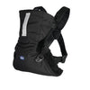 A black Chicco baby carrier with adjustable straps stands ready to secure a baby comfortably and safely. 
