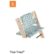 Stokke Tripp Trapp high chair fitted with a light blue, leaf-patterned seat cushion. 
