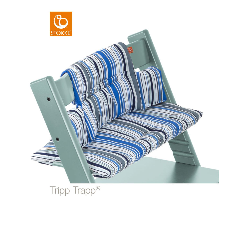Stokke Tripp Trapp high chair with a blue and gray striped cushion set. 
