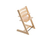 Natural wooden high chair with adjustable seat and footrest, shown from the side on a white background. 
